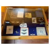 Military insignia pins with case...