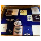 Military insignia pins with case...