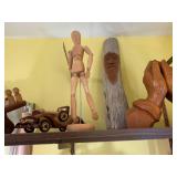 Wood carvings and books, all on 2 s...