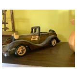 Wood carvings and books, all on 2 s...