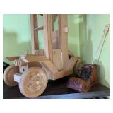 Wood carvings and books, all on 2 s...