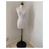 Mannequin on heavy metal base, with...