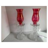 (2) Cranberry glass candle holders ...