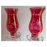 (2) Cranberry glass candle holders ...