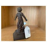 Cast iron door stop of child...