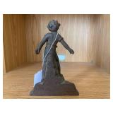 Cast iron door stop of child...