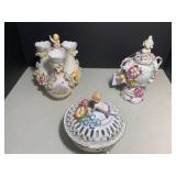 (3) German porcelain cherubs and fl...