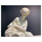 Woman seated tending to a child, 14...