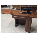 Singer Sewing Machine with Wood Flip-Top Cabinet 58" x 17" x 38"