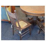 Vintage Clawfoot Wood Dining Table with (4) Wicker Seat Side Chairs
