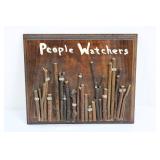 People Watchers Wood Wall Plaque with Twig Figures & Googly Eyes 11" x 9"