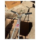 Red Devil broadcast spreader and a Hudson 2-gallon pump-less sprayer.