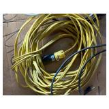 collection of various electrical extension cords and a power strip