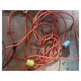 collection of various electrical extension cords and a power strip
