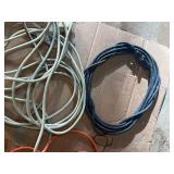 collection of various electrical extension cords and a power strip