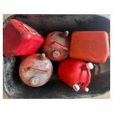 Lot of various gas cans including bucket.