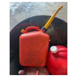 Lot of various gas cans including bucket.