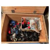 Vintage wooden storage box with contents inside