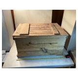 Vintage wooden storage box with contents inside