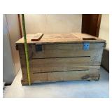 Vintage wooden storage box with contents inside
