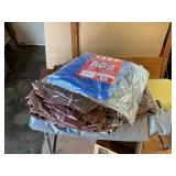 Miscellaneous tarps of various sizes and a cover for car or boat