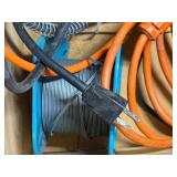 Wood box with electrical cords, battery tender and power strip.