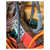 Wood box with electrical cords, battery tender and power strip.