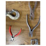 Box of tools including a come along and various hardware ect