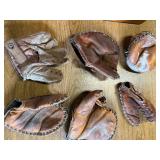 Lot of vintage baseball gloves.