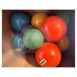 Lot of various balls , softball, croquet , baseball, golf