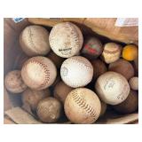 Lot of various balls , softball, croquet , baseball, golf