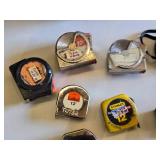 Lot of Hand Tools including Tape Measures, Metal Clamp, and Metal Holder