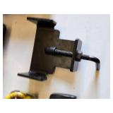 Lot of Hand Tools including Tape Measures, Metal Clamp, and Metal Holder