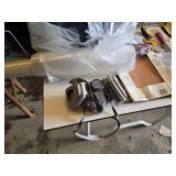 Assorted Painting and Home Improvement Tools including Brush Cleaner, Caulk Gun, and Respirator