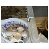 Plumbing and Hardware Tools and Supplies including Washing Machine Hose, Water Heater Connector, and Various Fittings