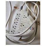 Assorted Electrical Components including APC Surge Protector, Power Strips, Extension Cords, and NEMA Enclosure