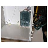 Assorted Electrical Components including APC Surge Protector, Power Strips, Extension Cords, and NEMA Enclosure
