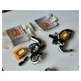 Lot of Flashlights and Headlamps Including Rechargeable LED Safety Lights, Black & Decker Work Light, and Accessories