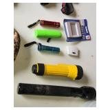 Lot of Flashlights and Headlamps Including Rechargeable LED Safety Lights, Black & Decker Work Light, and Accessories