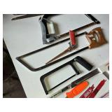 Assorted Hand Tools including Hacksaws, Hand Saws, and Measuring Tools