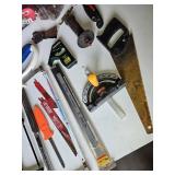 Assorted Hand Tools including Hacksaws, Hand Saws, and Measuring Tools