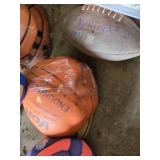 Assorted Sporting Goods Lot including Tennis Rackets, Basketballs, Volleyballs, and Footballs