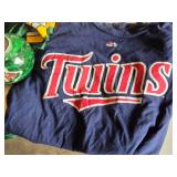 Green Bay Packers Favre #4 Jersey, Minnesota Twins Shirt, and Minnesota Wild Candle Holder