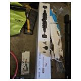 Various Exercise and Fitness Equipment including Mobility Wall Pro Series, Pilate Ring, and Dumbbells