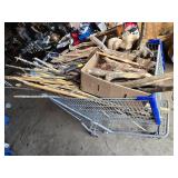 Shopping Cart full Sticks (some carved), Driftwood, and Hand Tools