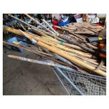 Shopping Cart full Sticks (some carved), Driftwood, and Hand Tools