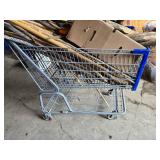 Shopping Cart full Sticks (some carved), Driftwood, and Hand Tools