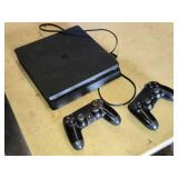 Sony PlayStation 4 Console with DualShock Controllers - Powers On, Needs a Cleaning