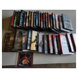 Lot of DVDs including Sherlock Holmes, The Incredibles, and The Matrix Collection