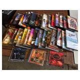 Collection of DVDs and CDs including Divergent, Spider-Man 2, and Christmas with Daniel